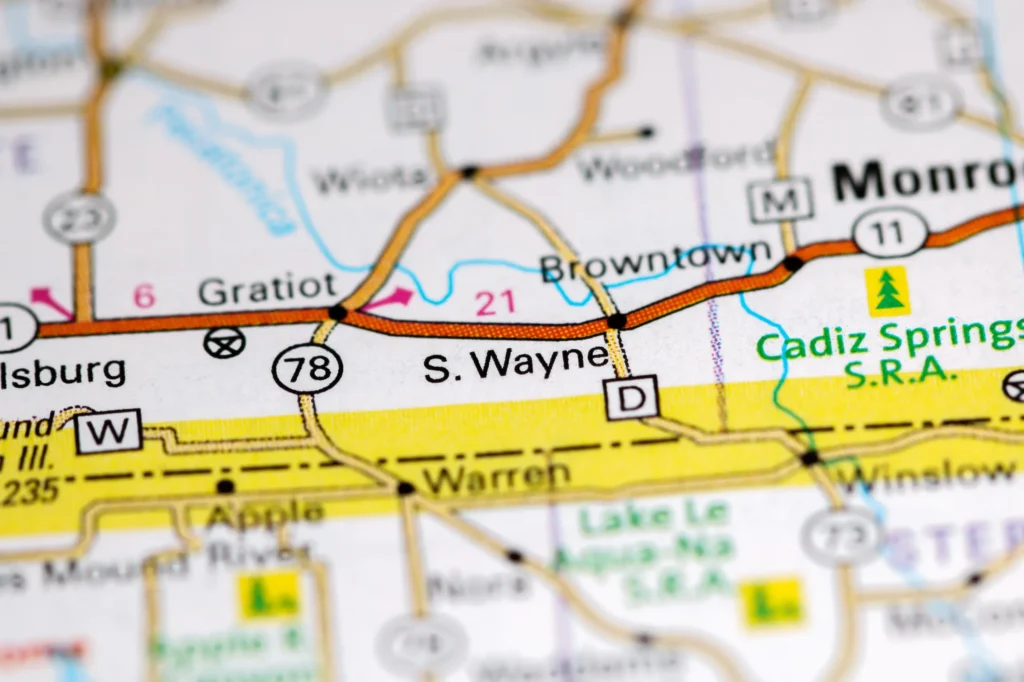 Close-up of a printed map focusing on Gratiot, Browntown, and Monroe with highway and route numbers.