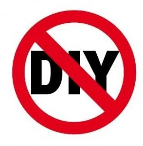 Red prohibition circle and diagonal line over bold black letters "DIY" on white background.